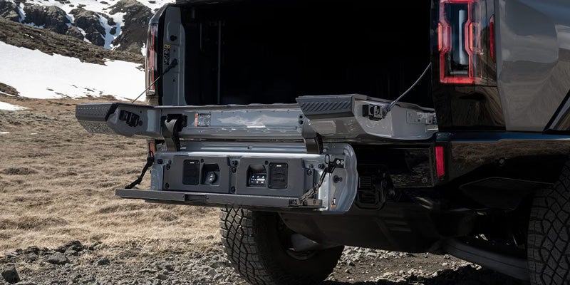 2026 Hummer EV loading and unloading the cargo bed