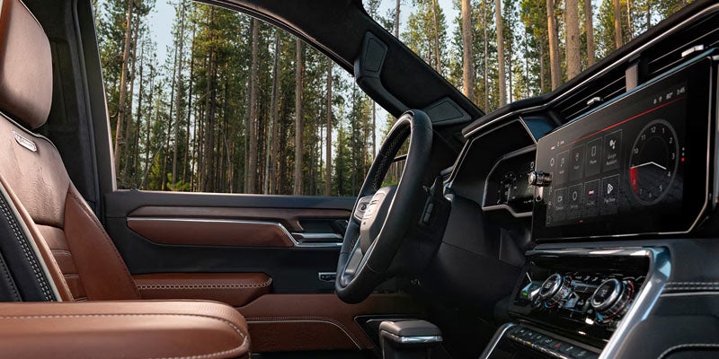 2026 GMC Sierra 1500 SLE interior featuring a premium steering wheel